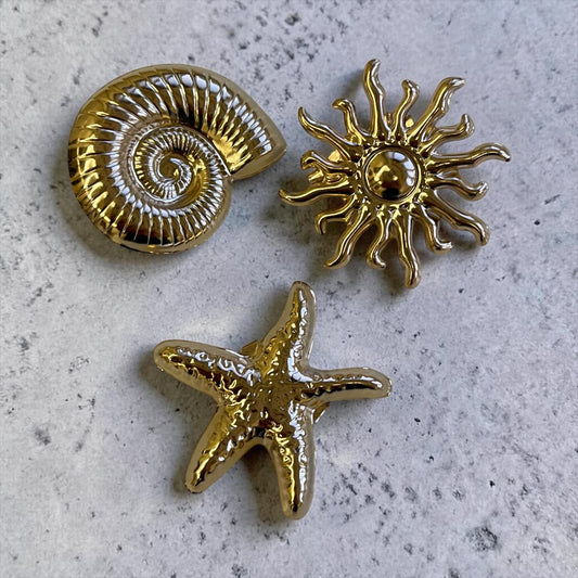 Golden Coastal Shell Brooch Set – Starfish, Spiral Shell & Sun Design (Set of 3)