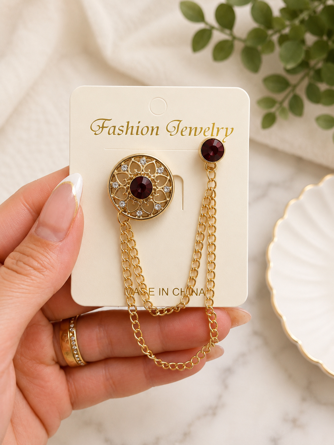 Elegant Gold Chain Brooch Pin with Burgundy Crystal Accent