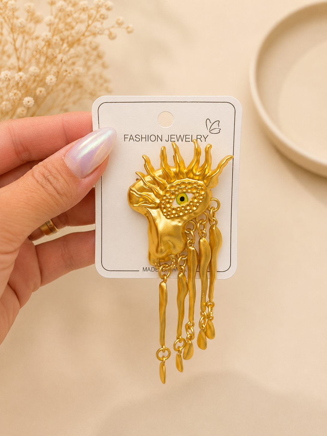Golden Evil Eye Face Brooch with Tassel Chains