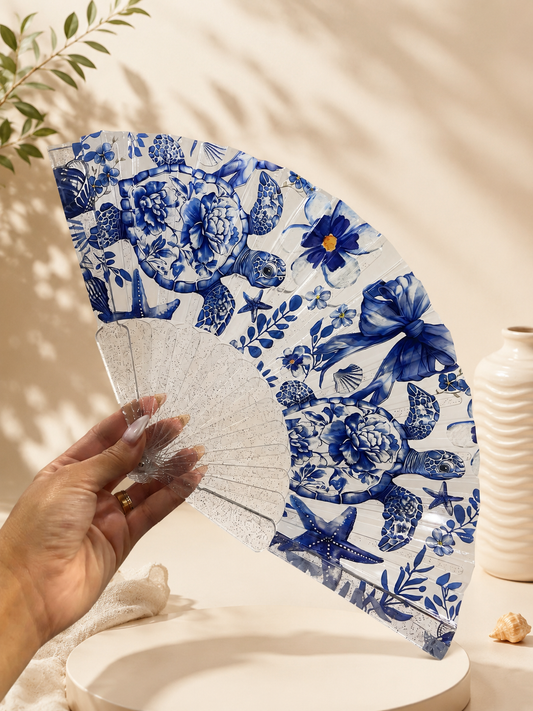 Folding plastic fan "Seashells and corals" glitter, 23 cm